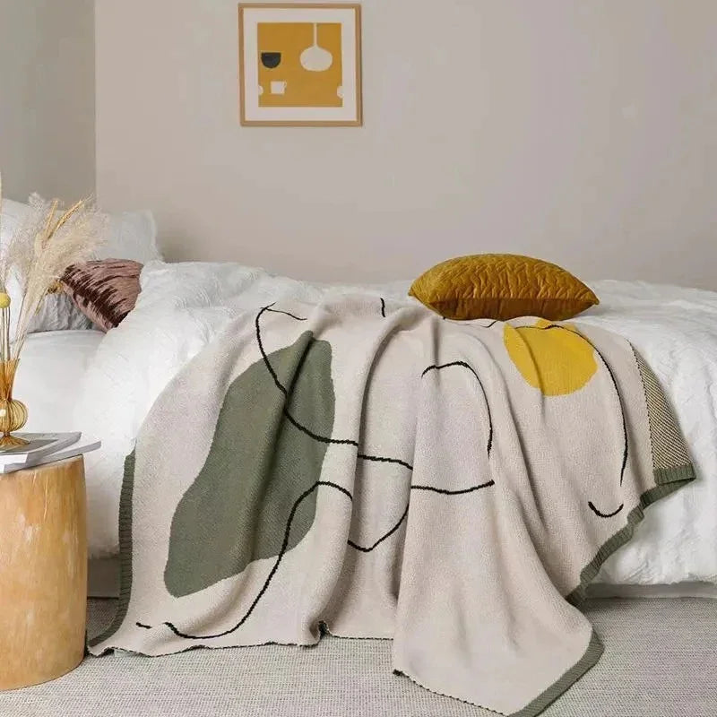 Clysella Throw Blanket