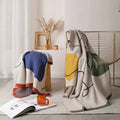 Clysella Throw Blanket
