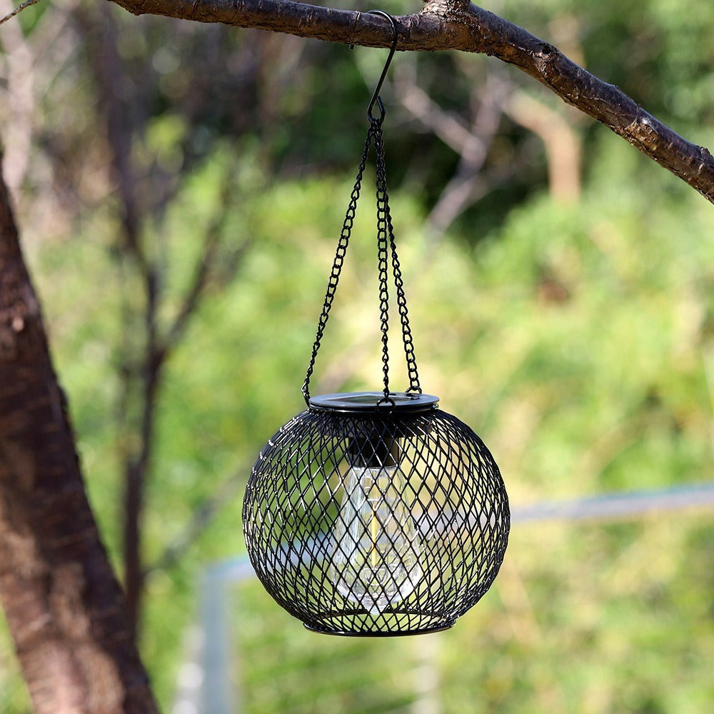 Outdoor Solar Hanging Lights in Metal Cage with Warm LED Candle Light | TheKanta