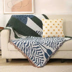 Urtirra Throw Blanket